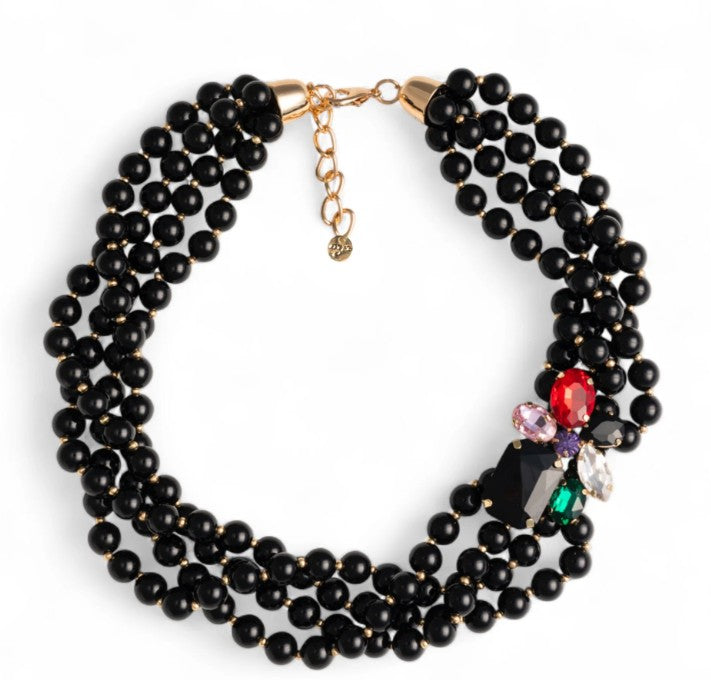 Collana girocollo multifilo con sfere in acrilico nere e fiore con pietre in vetro multicolore
